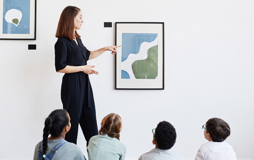 Art Education Teacher describing a work of art to her students